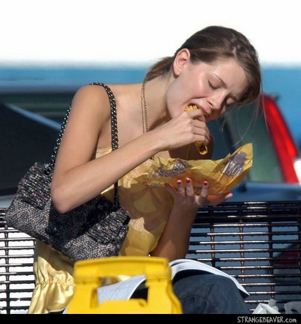 girl eating taco
